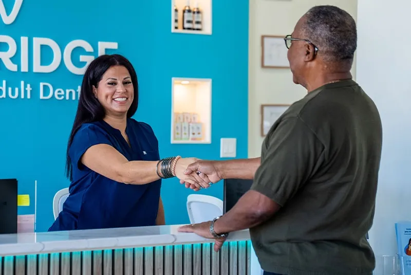 Patient reviewing dental implant treatment costs