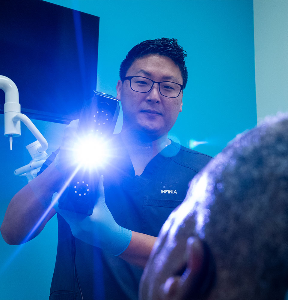 Doctor examining a patient during a dental consultation